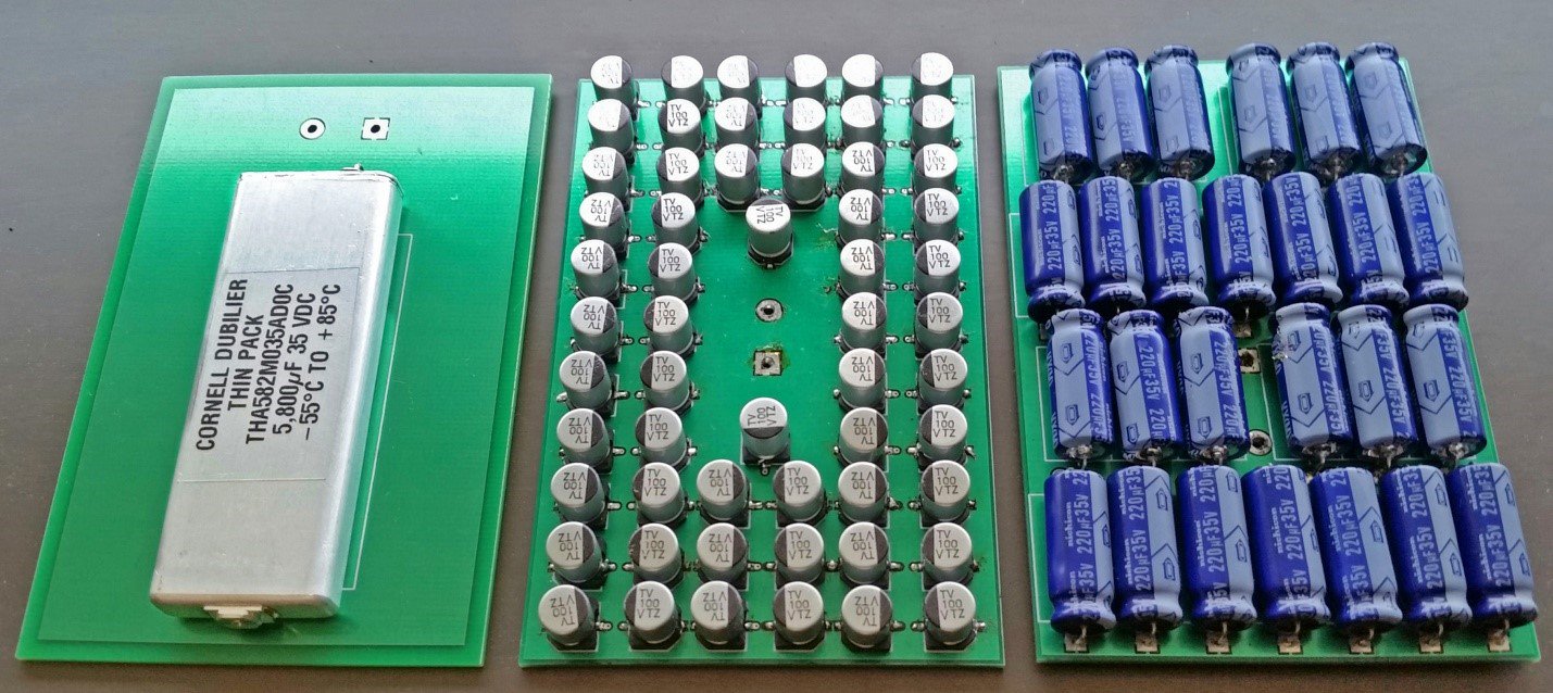 Comparison of PCB real estate filled by flat CDE electrolytics (left), with SMT V-chips and tantalum caps.