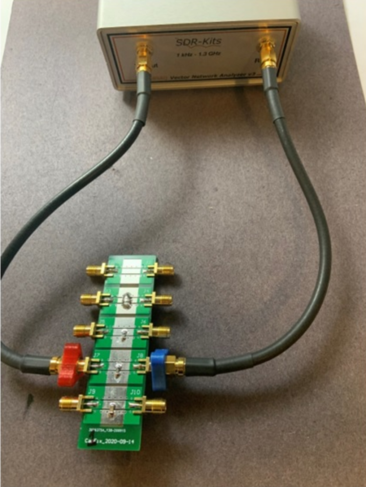 Figure 1. The complete system with the VNWA and fixture board with a selection of structures and capacitors.